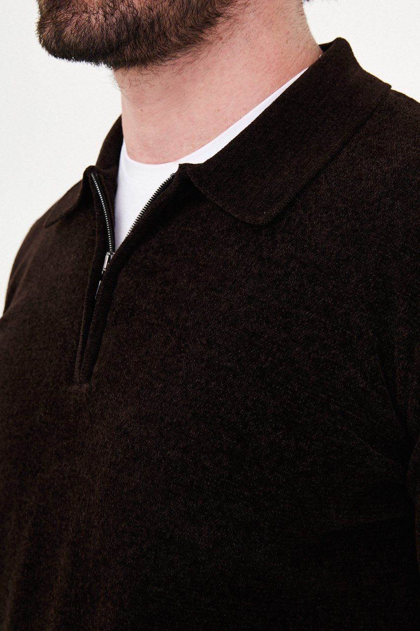 Close-up of the brown sweater's textured knit, polo collar and metal quarter-zip fastening