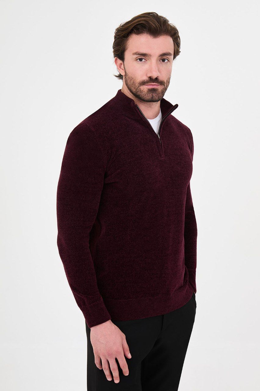 Angled view of a man wearing a burgundy textured quarter-zip sweater