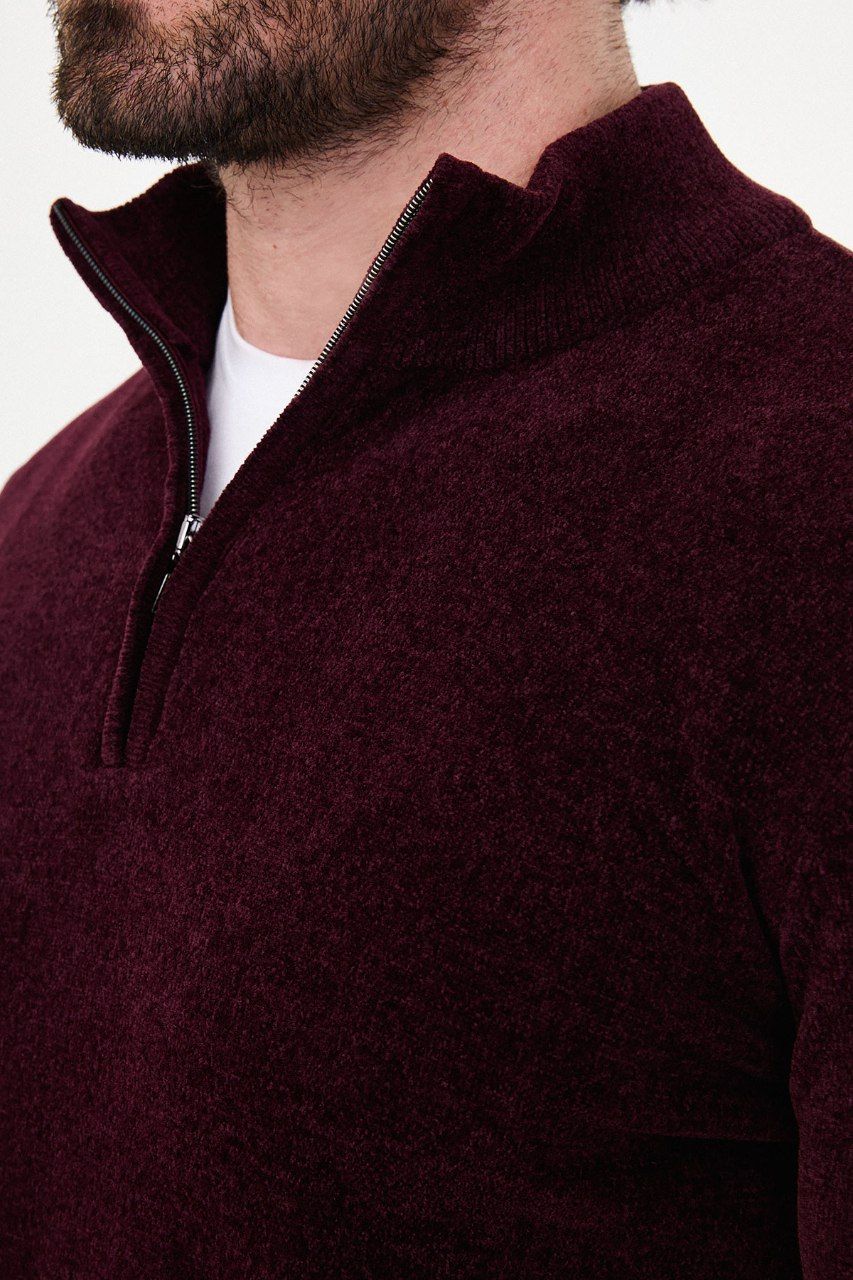 Close-up of the burgundy sweater's textured knit and stand collar and quarter-zip fastening