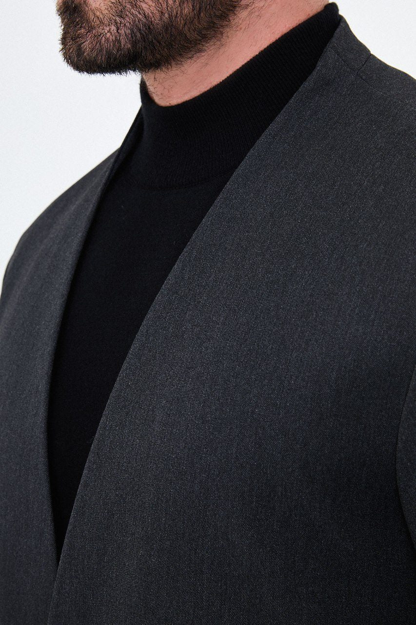 Men's charcoal grey collarless one-button two-piece suit neckline fabric detail