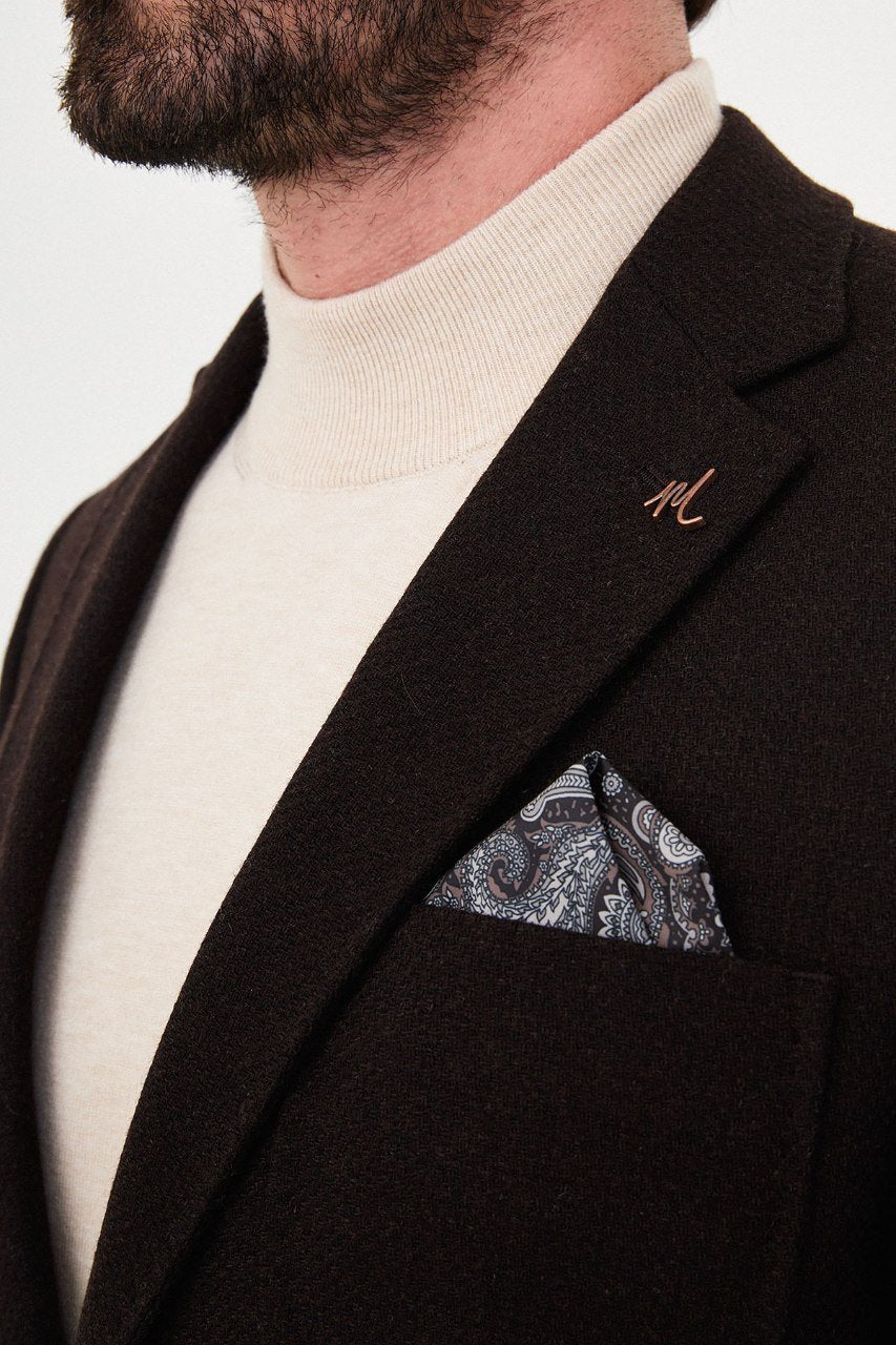 Notch lapel and chest pocket on chocolate brown blazer