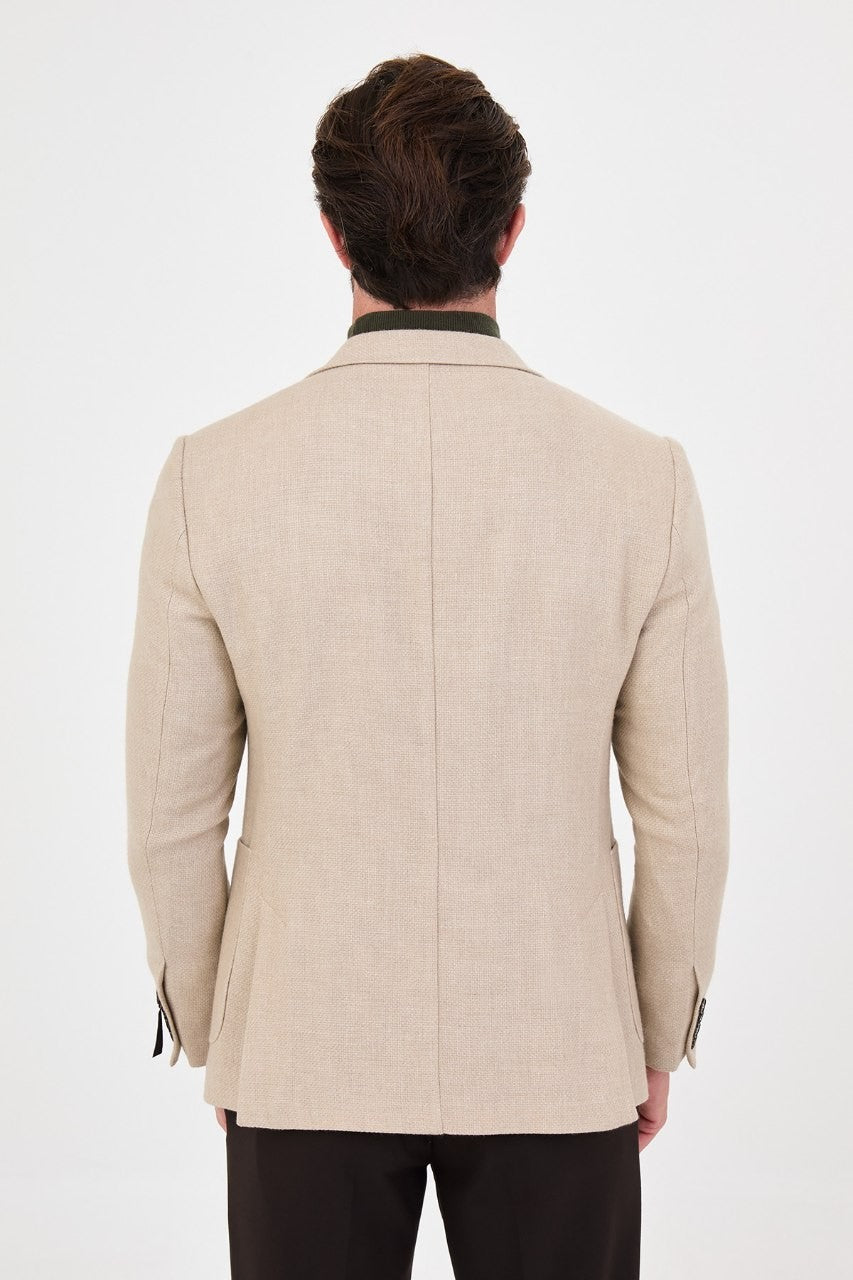 Back view of men’s cream blazer