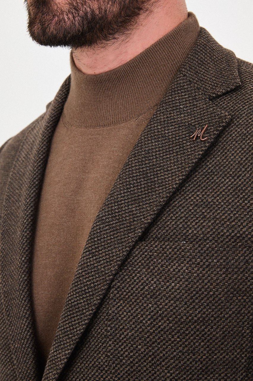 Notch lapel and chest pocket on dark brown blazer