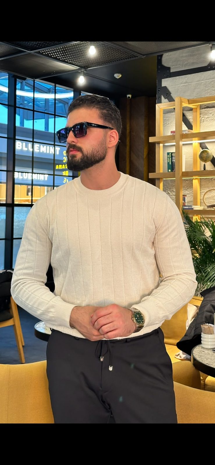 Men’s Ecru crew neck sweater styled with dark trousers
