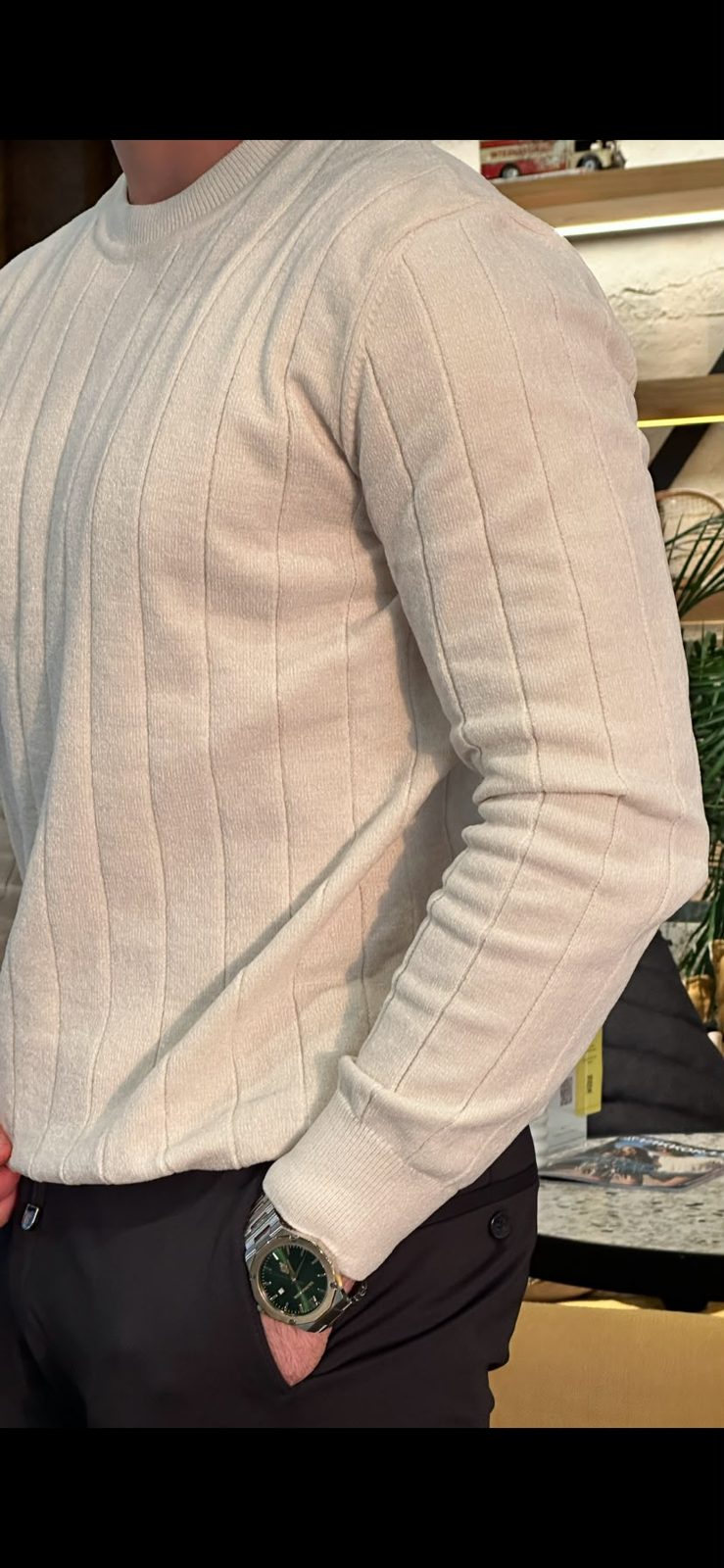 Close-up of Ecru sweater shoulder and sleeve knit
