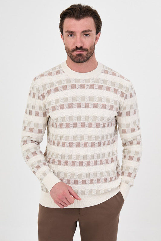Front view of a man wearing a ecru geometric knit crew neck sweater