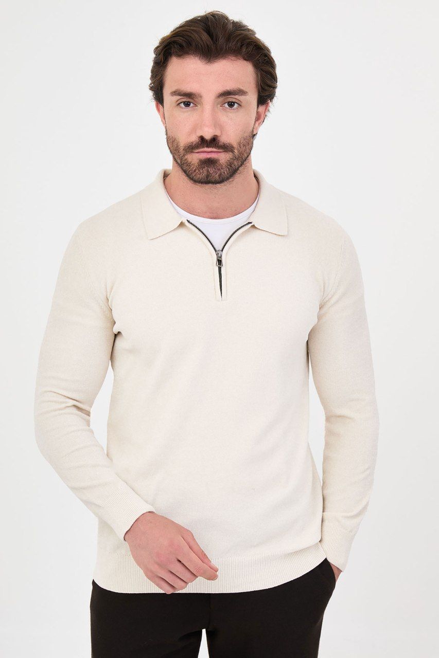 Front view of a man wearing a ecru textured quarter-zip polo sweater