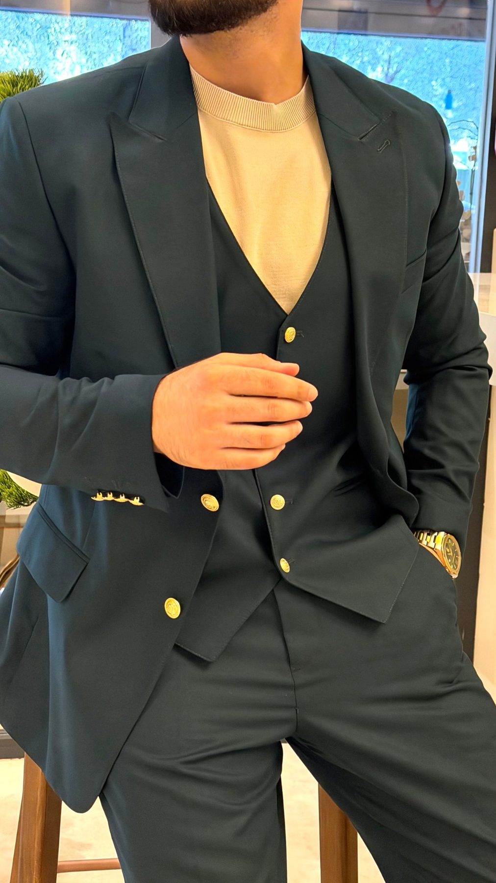 Men's emerald green peak-lapel jacket and matching waistcoat with gold-tone buttons