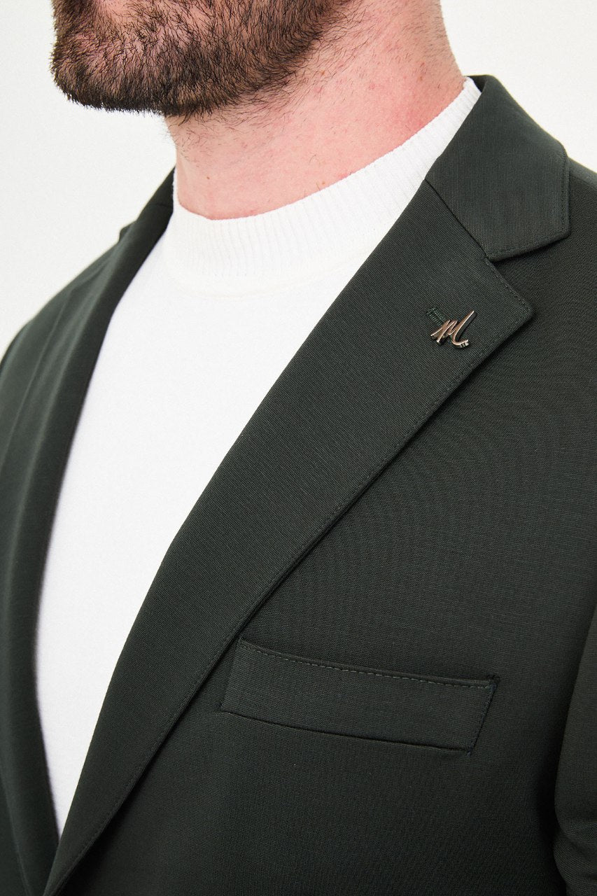 Men's dark green two-piece suit notch lapel close-up