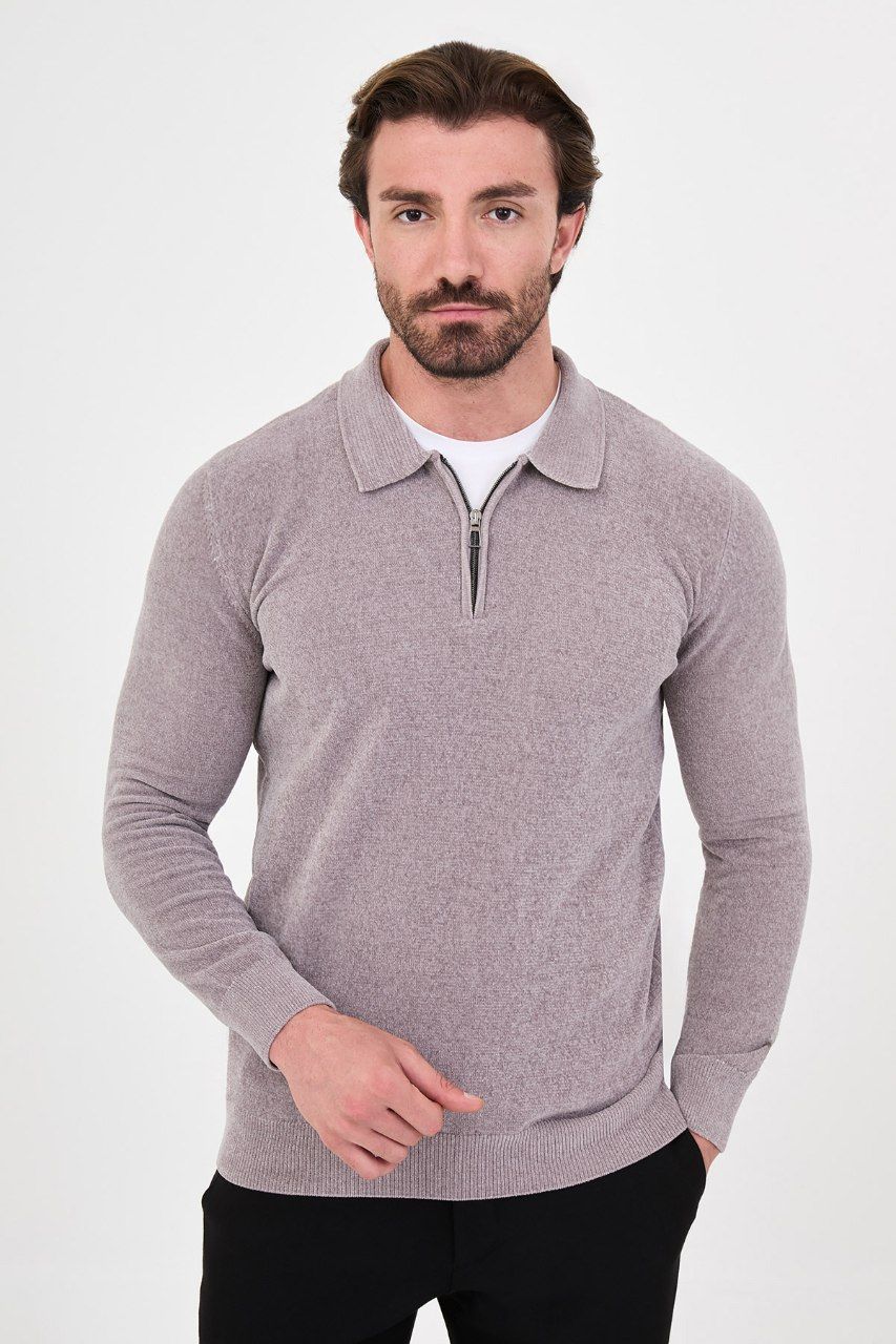 Front view of a man wearing a grey textured quarter-zip polo sweater