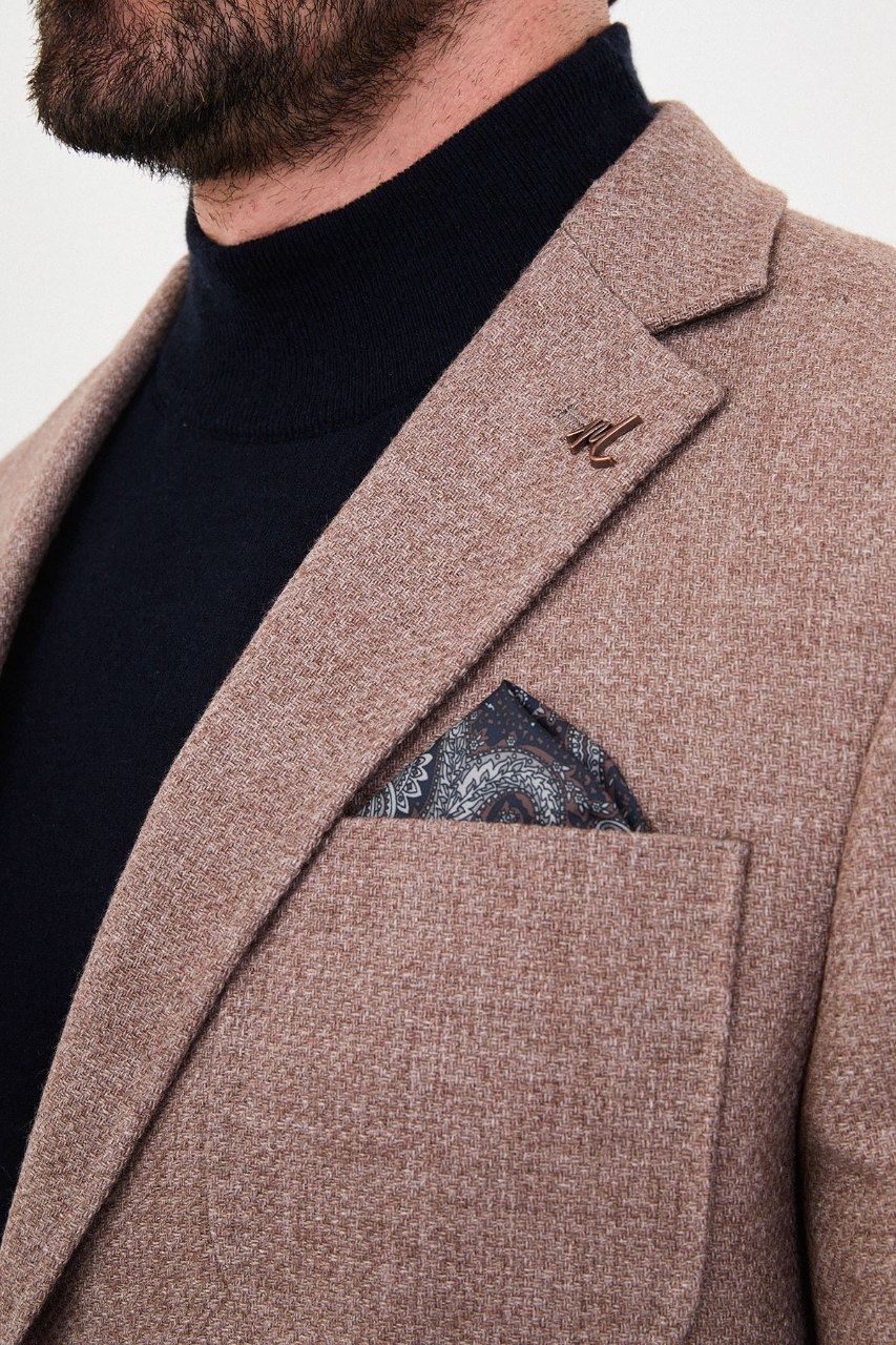 Notch lapel and chest pocket on light brown blazer
