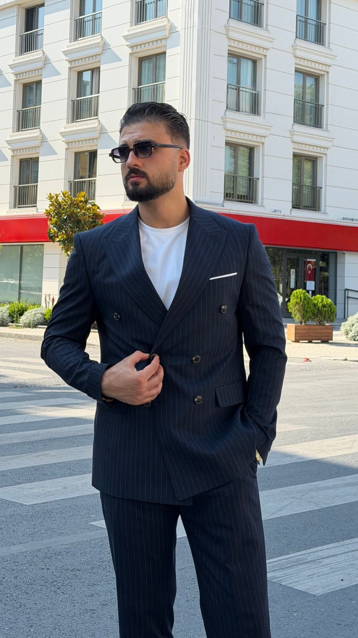 Front view of men's navy blue pinstripe double-breasted two-piece suit