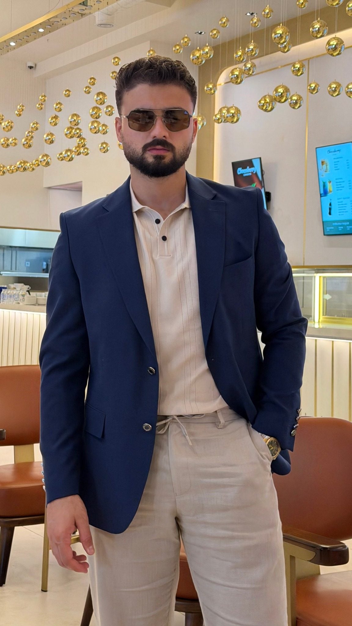 Men's navy blue single-breasted blazer with notch lapels, full front view