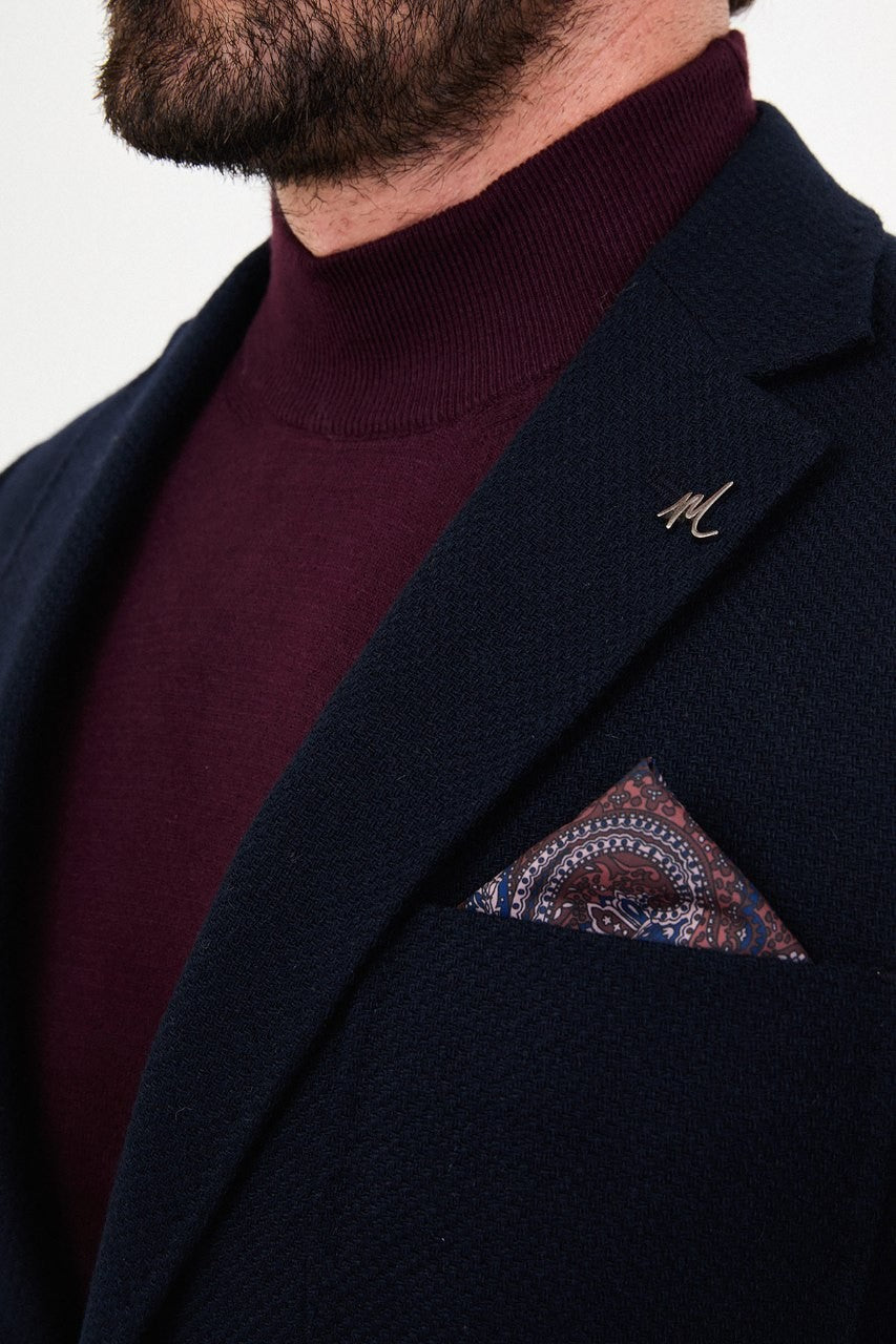 Notch lapel and chest pocket on navy blue blazer