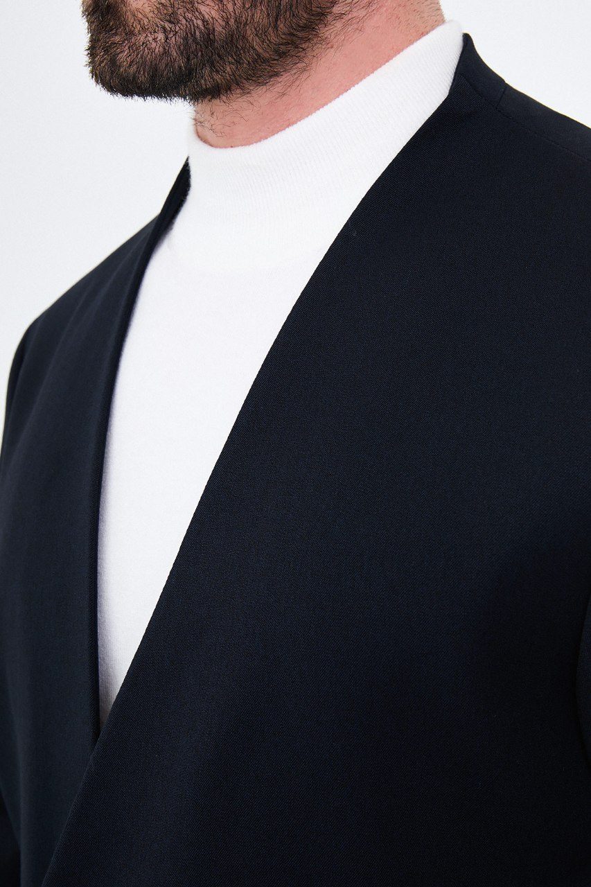 Men's navy blue collarless one-button two-piece suit neckline fabric detail