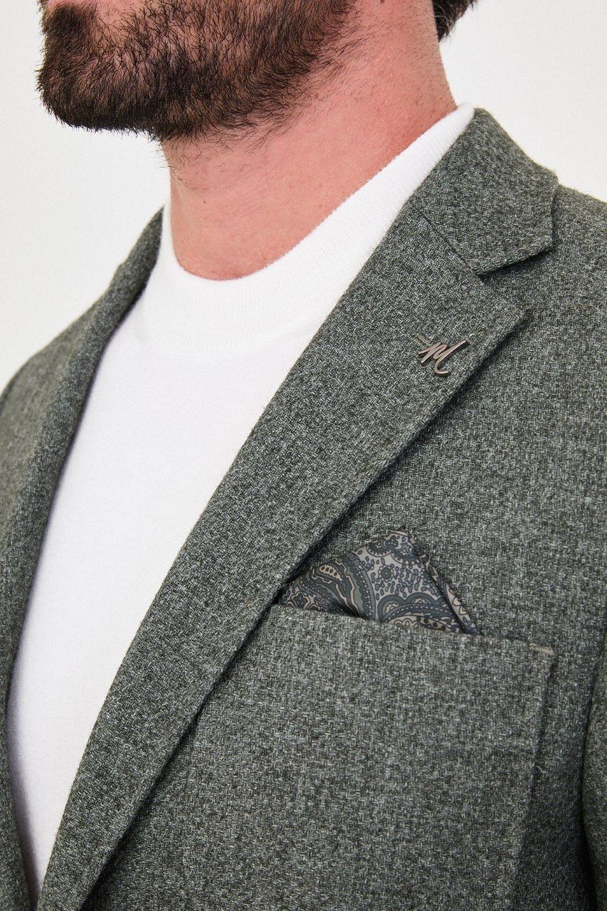 Notch lapel and chest pocket on olive green blazer