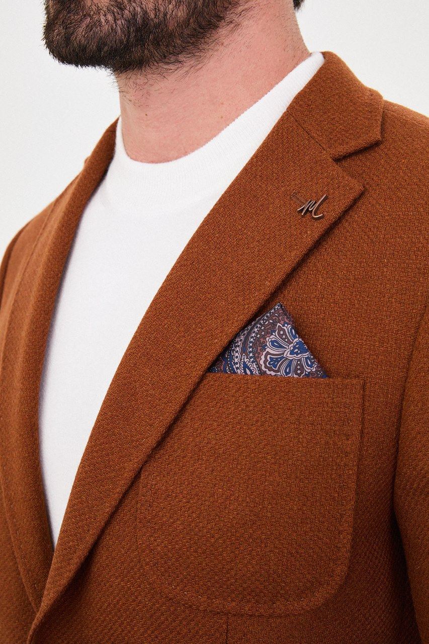 Notch lapel and chest pocket on rust orange blazer