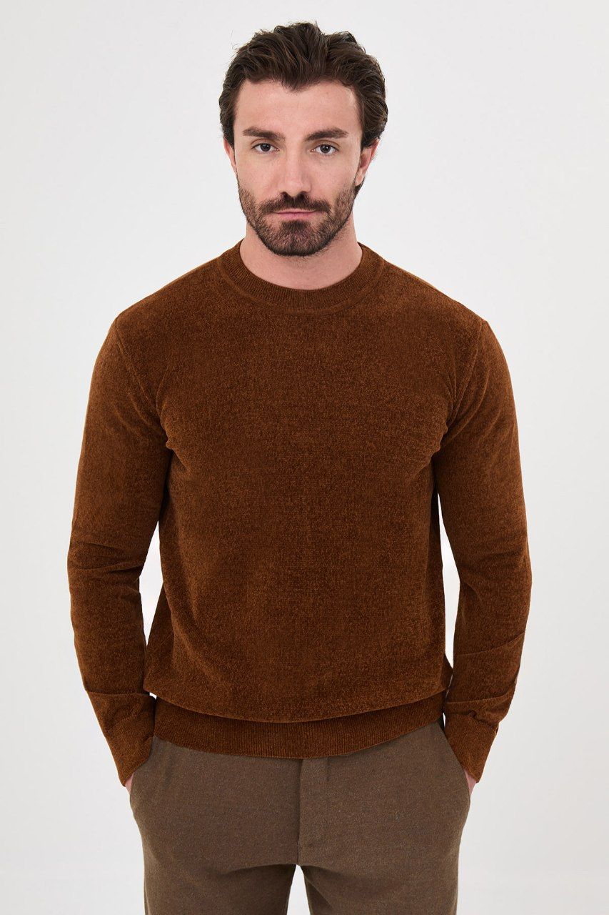 Front view of a man wearing a rust textured crew-neck sweater