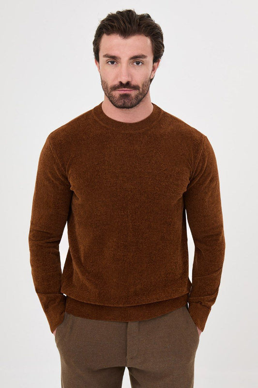 Front view of a man wearing a rust textured crew-neck sweater