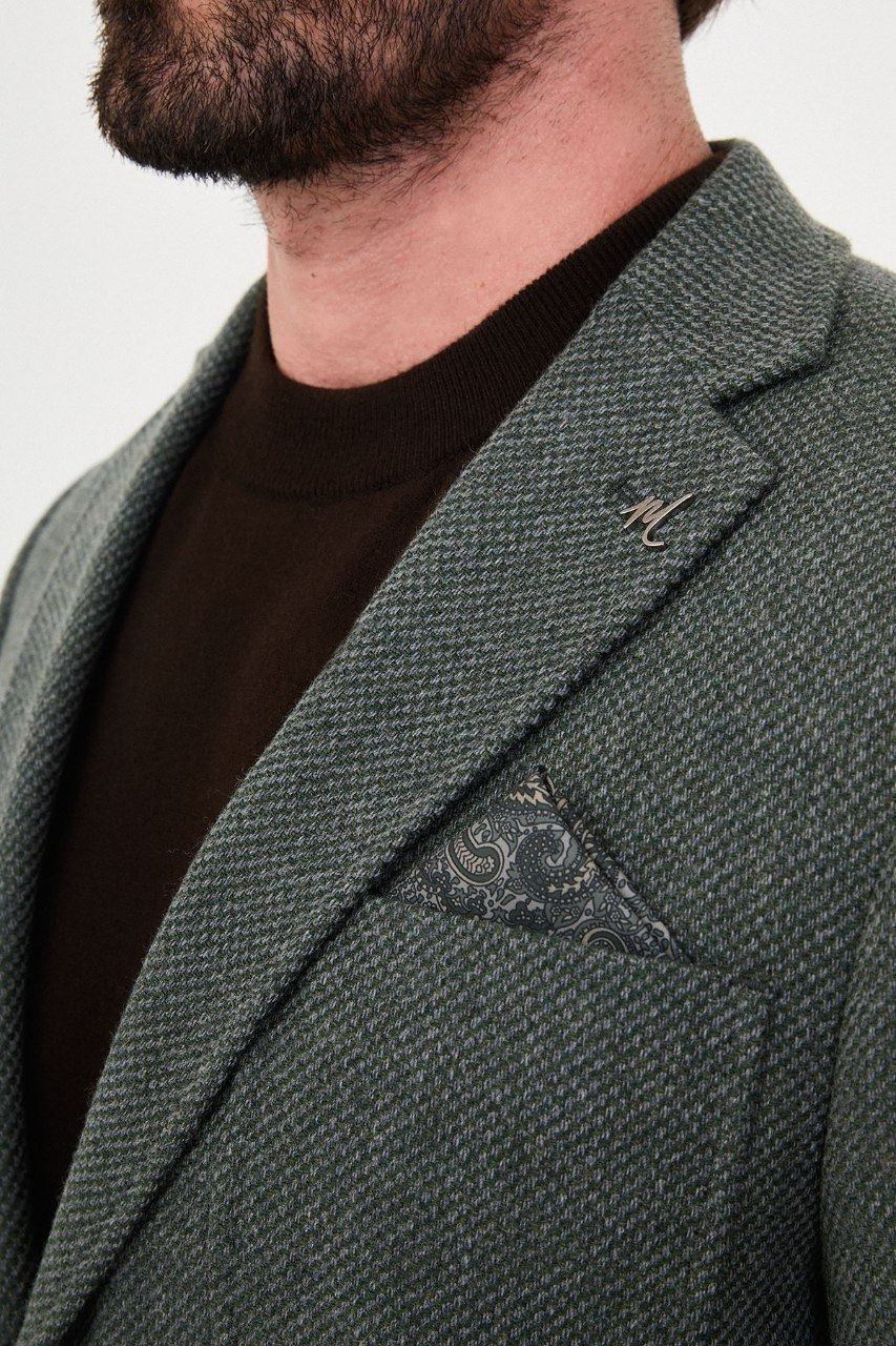 Notch lapel and chest pocket on sage green blazer