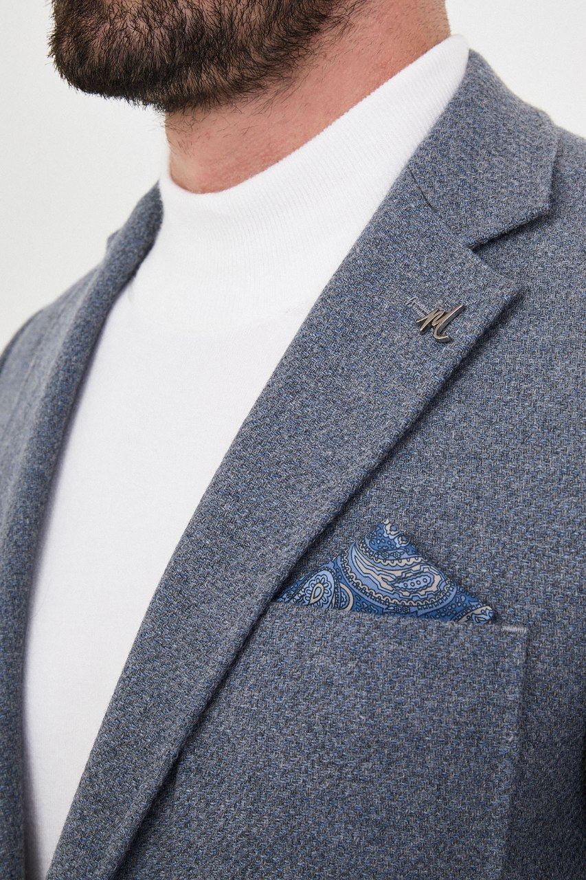 Notch lapel and chest pocket on slate blue blazer
