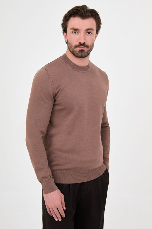 Front view of a man wearing a taupe crew neck sweater