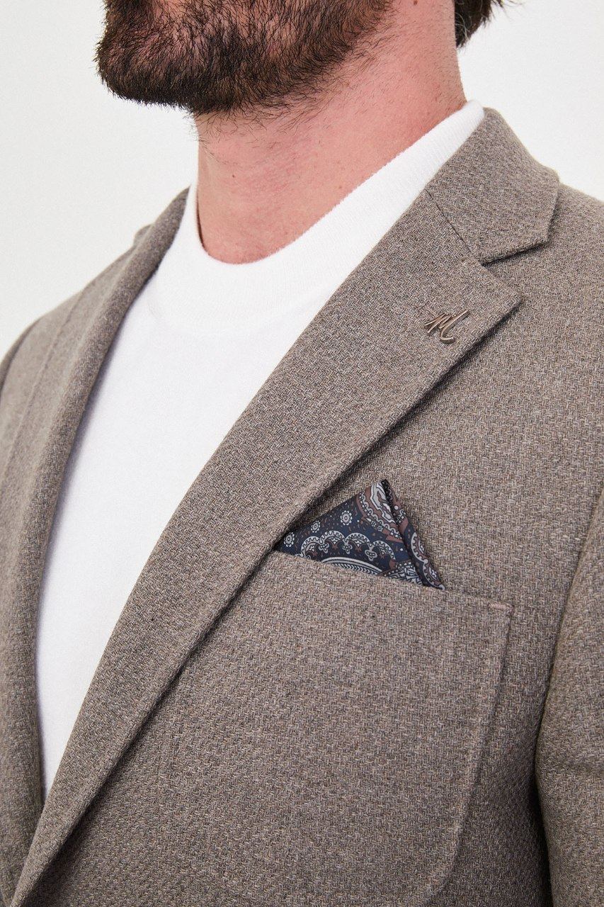 Notch lapel and chest pocket on taupe blazer