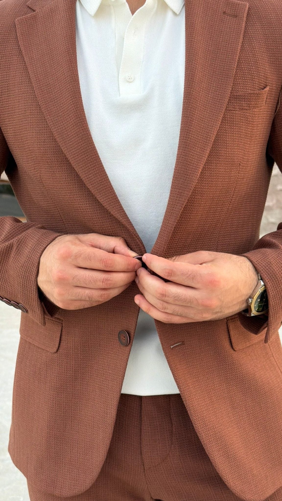 Close-up of men's Tile textured suit jacket with notch lapels and flap pockets
