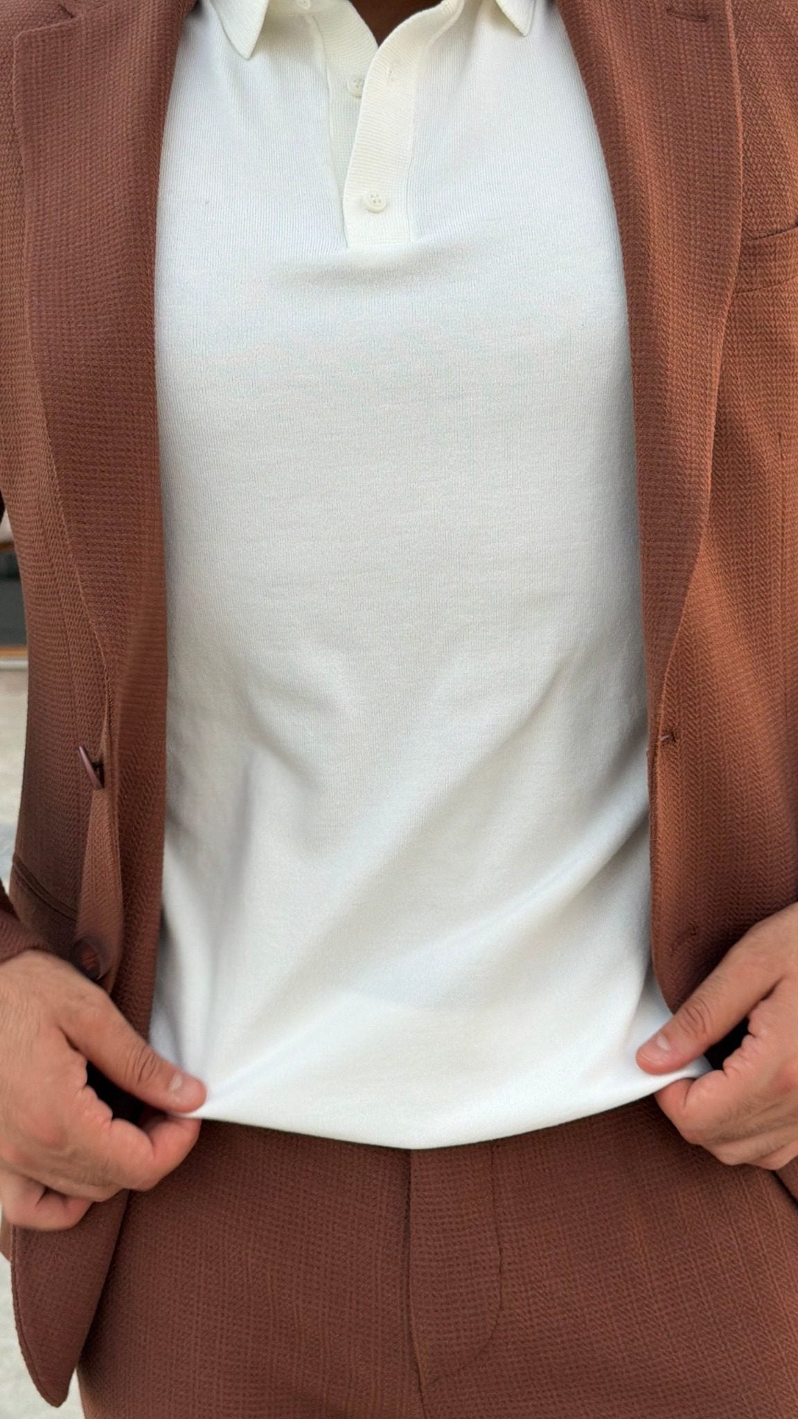 Men's Tile textured suit styled with a white polo shirt, front detail