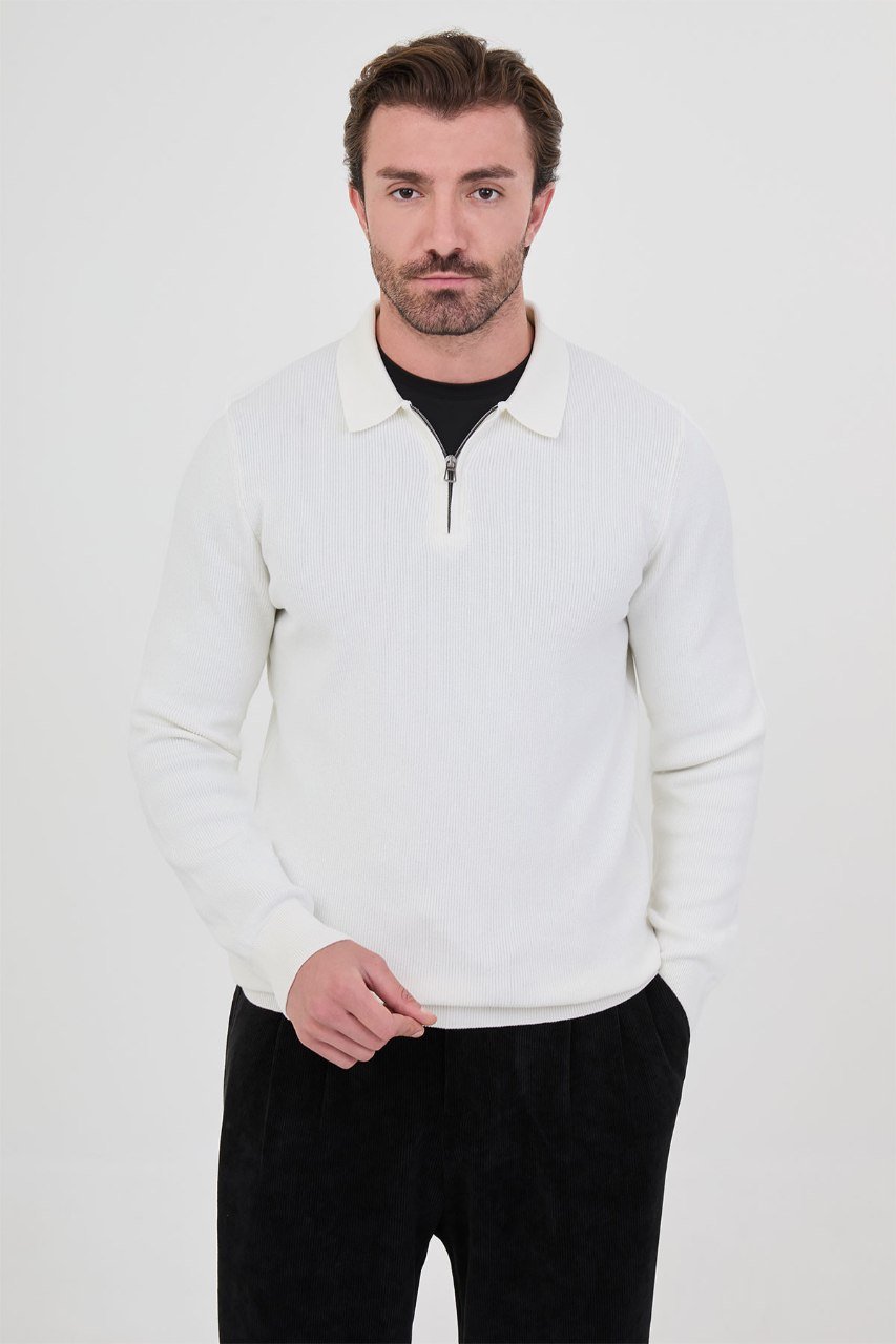 Front view of a man wearing a white ribbed quarter-zip polo sweater