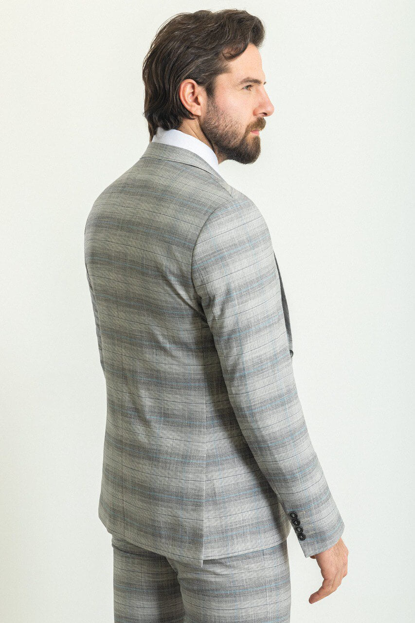 Man wearing a stylish Gray Blue Patterned Suit, perfect for blue gray suit combinations and weddings.