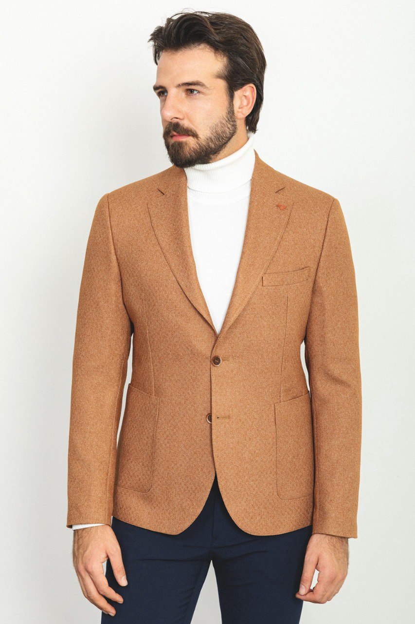 Man wearing a Camel Sophistication Blazer with a pointed collar, flap pockets, and a slim fit, perfect for weddings and business meetings.