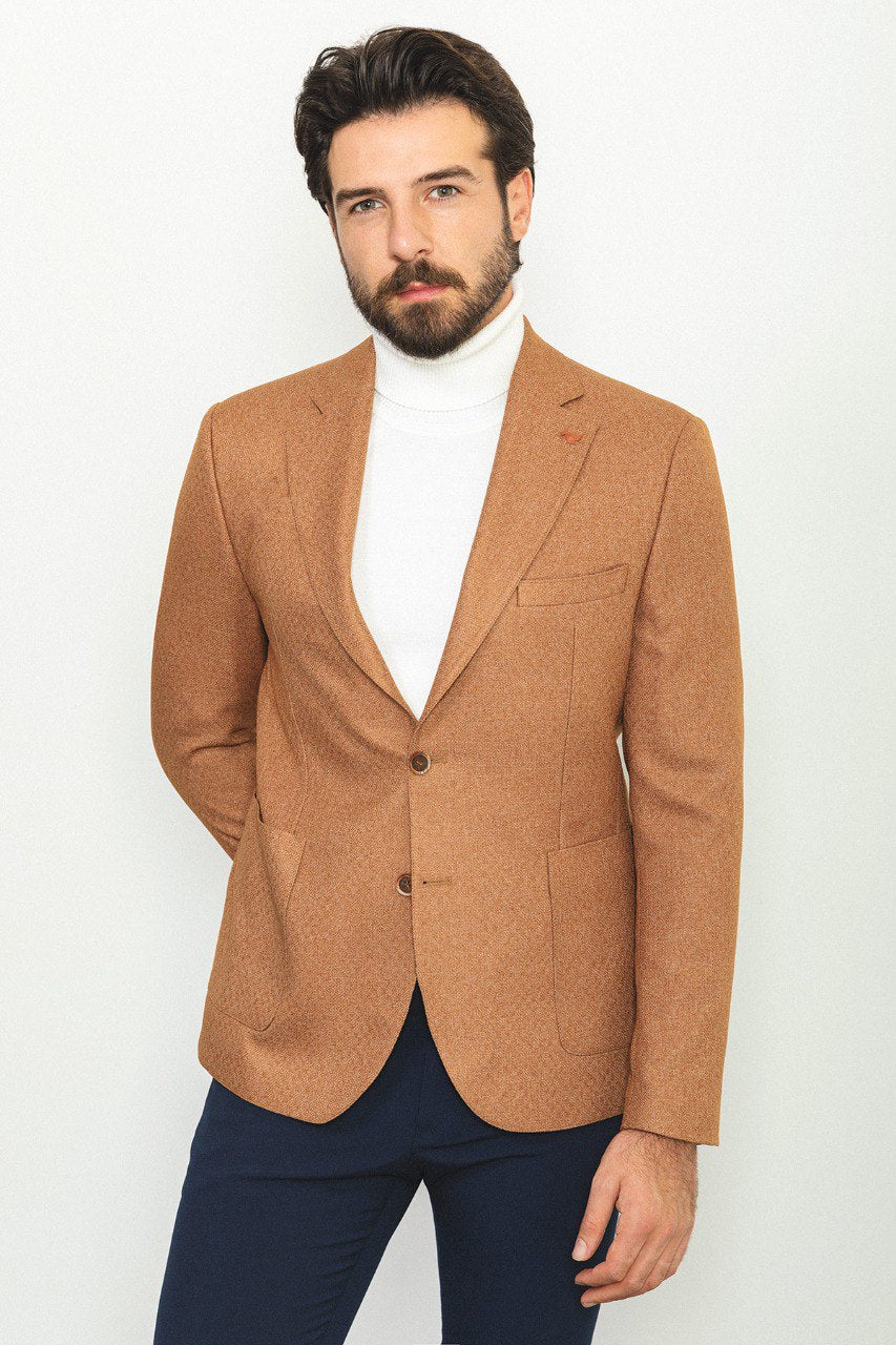 Man wearing a Camel Sophistication Blazer with a pointed collar, flap pockets, and a slim fit, perfect for weddings and business meetings.