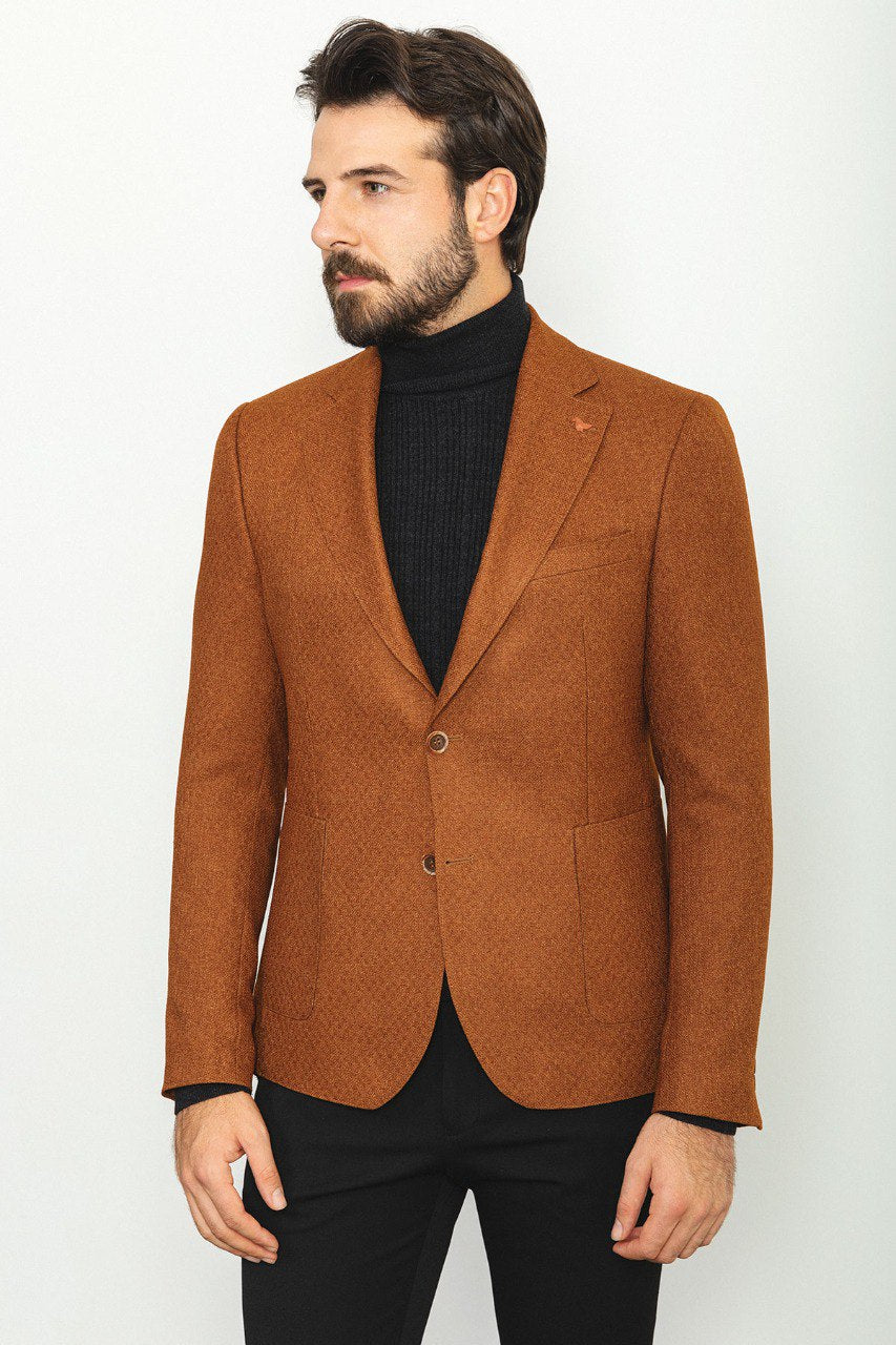 Man wearing a Hazelnut Heritage Blazer with a pointed collar, flap pockets, and a slim fit, perfect for formal events and casual outings.