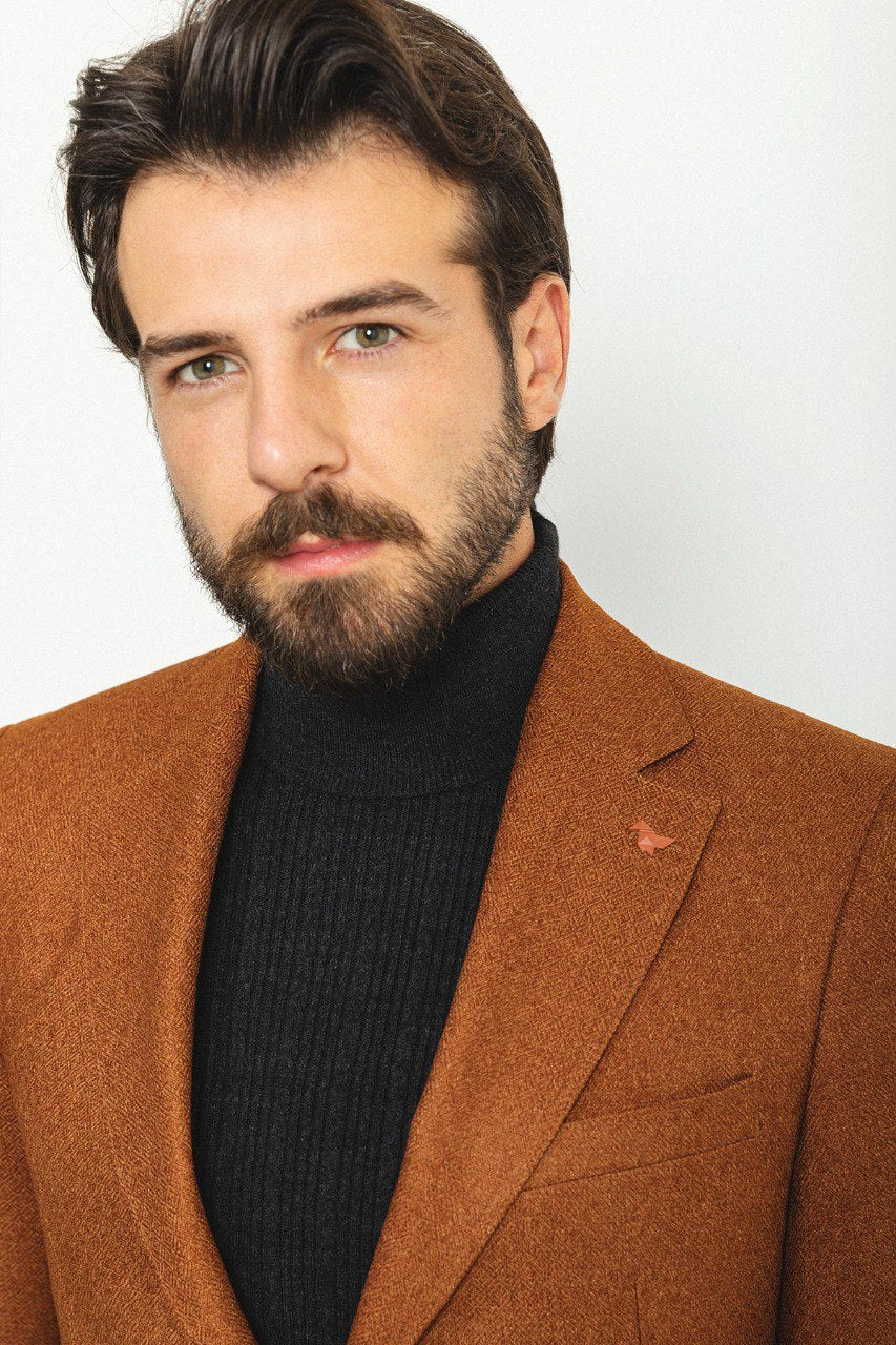 Man wearing a Hazelnut Heritage Blazer with a pointed collar, flap pockets, and a slim fit, perfect for formal events and casual outings.