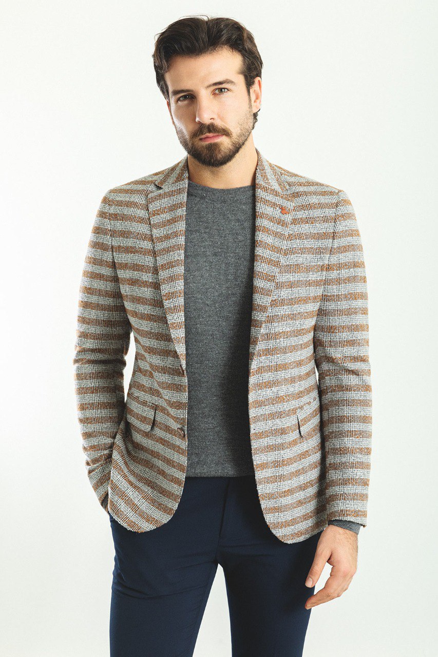 Man wearing a Sepia Glen Plaid Blazer with a pointed collar, flap pockets, and a slim fit, perfect for office meetings and casual outings.