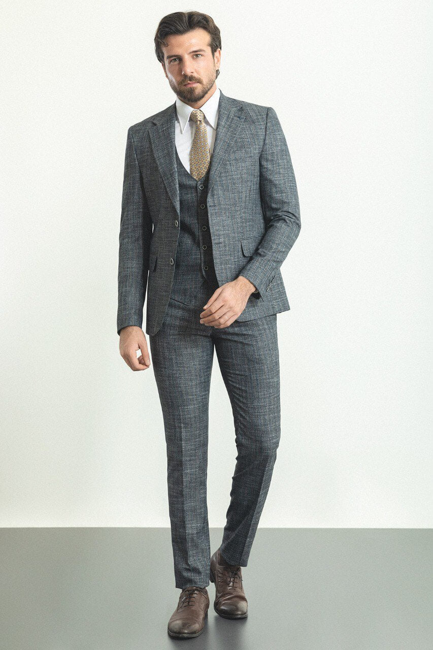 Man in a slim-fit gray 3-piece suit, showcasing elegant men's formalwear.