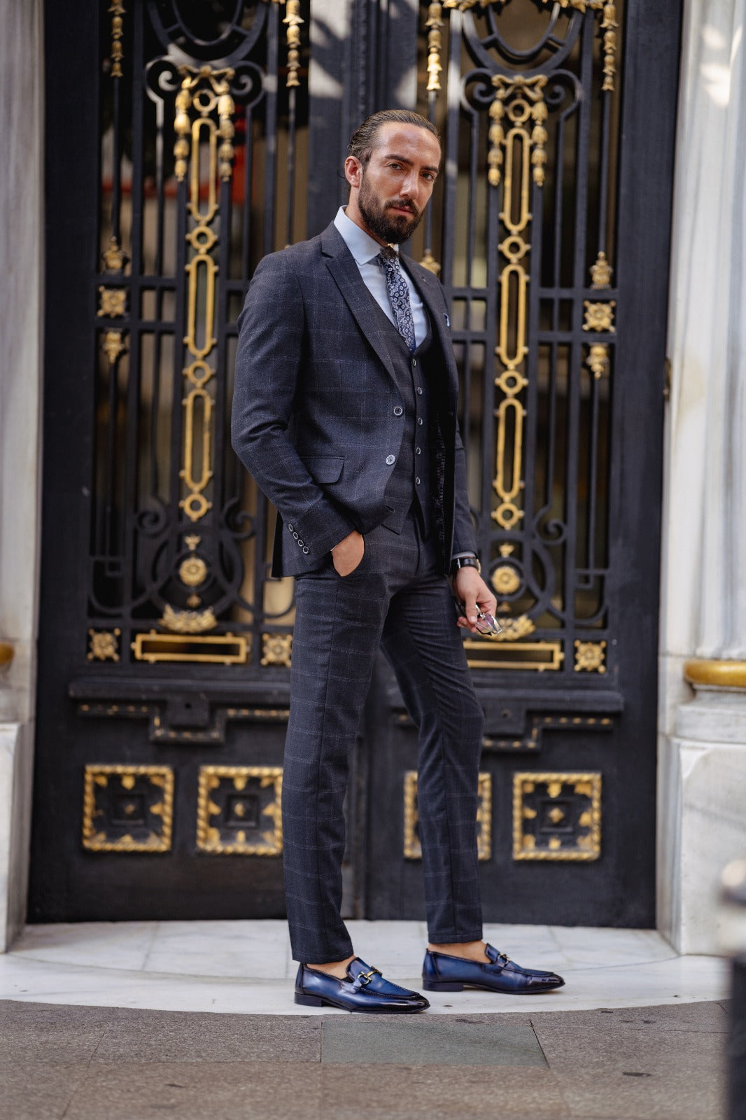 A Navy blue Slim Fit Plaid Detailed Suit on display.