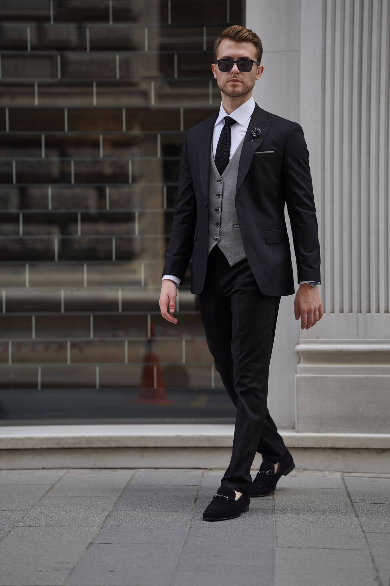 A Slim Fit Wool Black and Gray Suit on display.