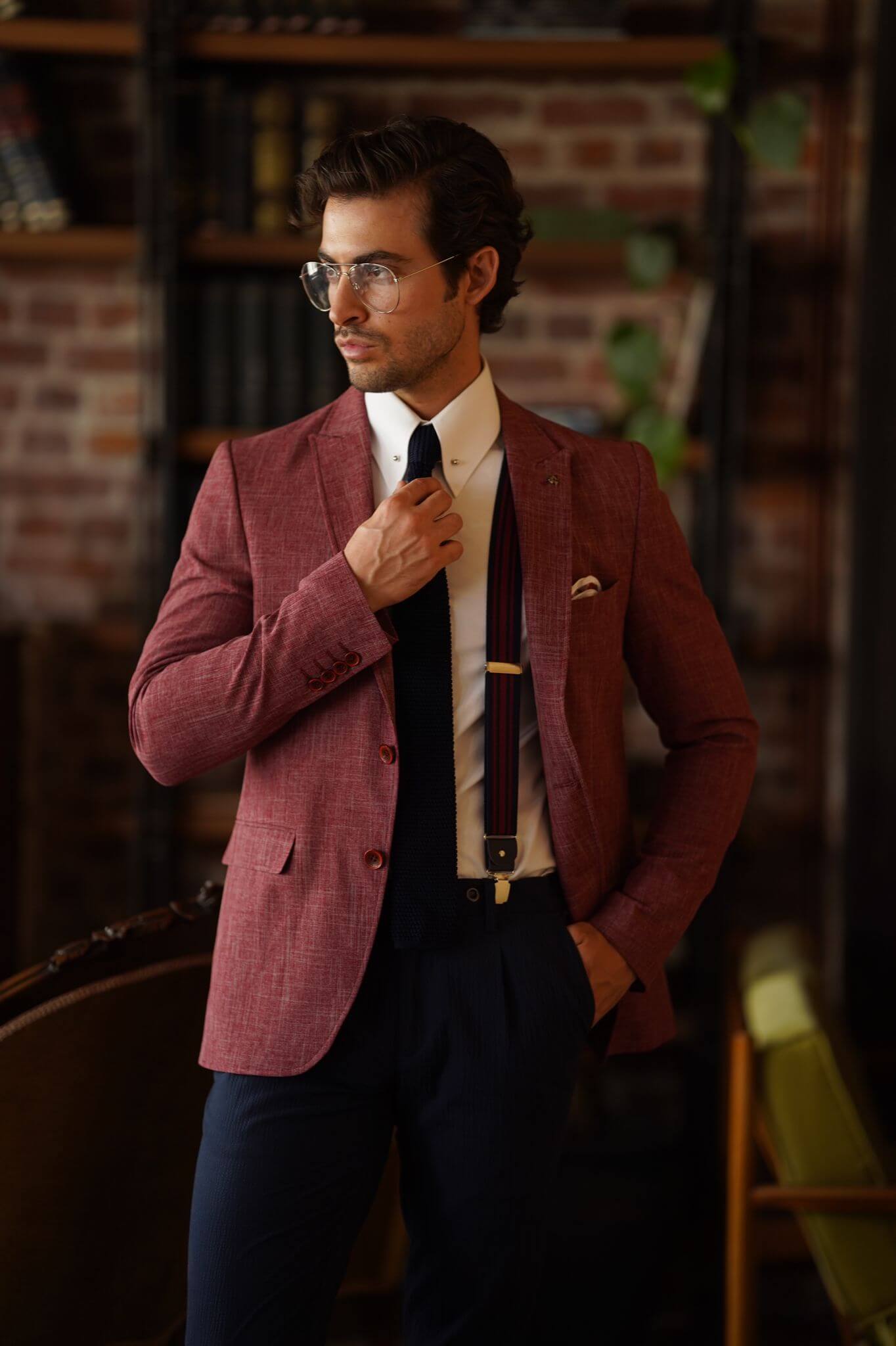 A Slim-Fit Self patterned Cotton Claret Red Blazer on display.